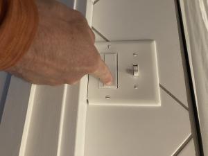 Use the wall switch to turn on the bathroom exhaust fan