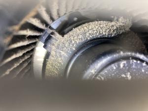 Visual inspection shows a considerable amount of dust has accumulated on this bathroom exhaust fan motor and fan blades