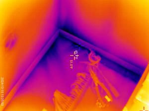 This infrared image shows cold air entering the home through leaks in the sill plate 