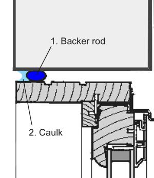 Caulk applied against the backer rod to seal a window rough opening