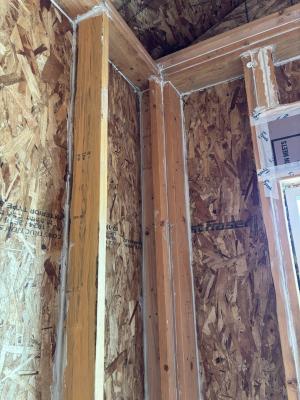 All wall cavities in this exterior wall were air sealed by caulking the sheathing to the frame and caulking the joints between framing members