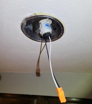 When retrofitting an old recessed can fixture, connect the wire adapter for the new LED retrofit fixture to the old light socket by screwing it into the bulb socket 