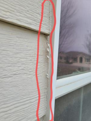 The exterior caulking around this window is clearly cracked, indicating that the caulking is no longer performing well and should be replaced.