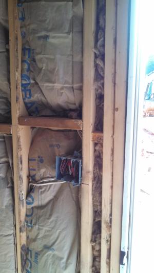 Wrong - Craft faced batt insulation is not cut to fit around wiring and eletrical boxes and is squished into corners forming voids which could encourage cold spots in wall.