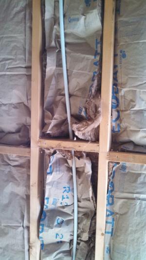 Wrong - Craft faced batt insulation is not cut to fit  around PEX plumbing pipe.