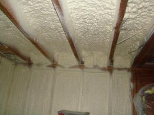 Right - A “flash” seal approach with spray foam provides a continuous air barrier between the ceiling and walls of the garage and the living space.