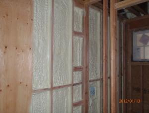 Right – Closed-cell spray foam insulation in the shared wall between the garage and living space helps to air-seal the wall and protect  occupants from garage pollutants.