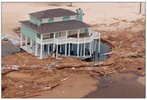 Deep scour around foundation piles from coastal flooding.