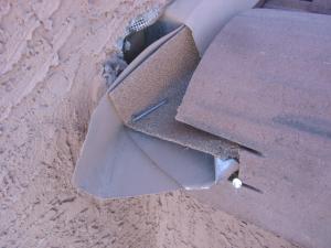 Improvised deflectors that are improperly integrated into the wall flashing and gutter are rarely sized to handle the volume of water that can run off the roof in a large downpour and they may contribute to water entry into the wall.