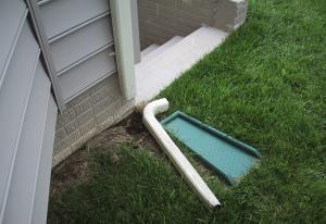 Downspout extensions and splash blocks often get disconnected to mow the lawn, then fail to get reconnected, allowing water from the gutters to discharge directly next to the house and in this case to stairs leading to the basement.