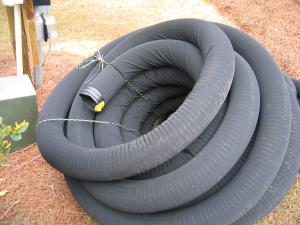 Drain tile with protective cover