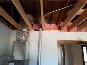 Wrong - HVAC duct and flue are too close to wall and will be difficult to properly air seal and insulate around when ceiling is installed.