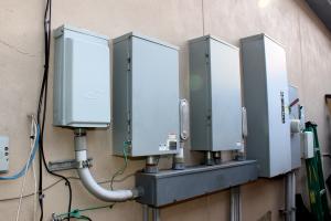 Durable Energy Builders installed a natural gas generator integrated with the solar electric system via a “smart panel” so that household utilities automatically switch to the generator during power outages in the disaster-resilient home.