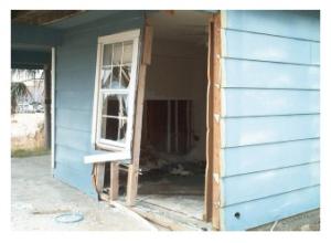 Wrong - During high winds air entered the home elsewhere and pushed out the door which was inadequately anchored to the wall.