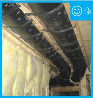 Ducts are properly insulated and supported without compressing the insulation
