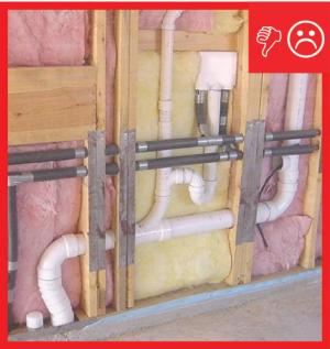 Wrong – Compression and misalignment because insulation is not split around plumbing