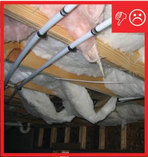 Wrong - Sub-floor insulation is not properly installed or supported.