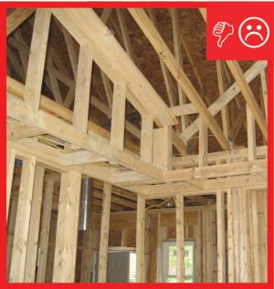 Wrong - No air barrier is present between the dropped ceiling/soffit and the attic.