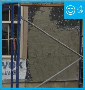 The water-resistant barrier, weep screed, and stucco lathe are properly layered and will create a complete drainage system