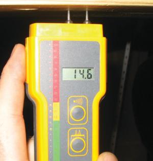 A moisture meter verifies that the moisture of the framing is below the recommended 18%.