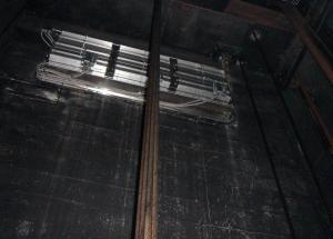 An elevator shaft vent with a motorized damper in a multistory multifamily building provides smoke and hot gas control in an elevator shaft during fire events; during normal operation the damper remains closed to reduce energy loss.