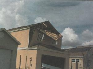 End wall failure under hurricane force winds due to inadequate bracing of the gable end wall.