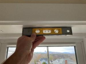 Ensure that the top of the window well is level prior to installing blinds.