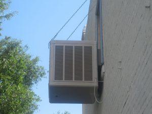 Right - This evaporative cooler is wall mounted to reduce leak effects and allow for ease of maintenance.