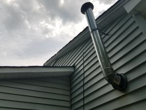 Wrong - Exhaust pipe is not vertical; poorly installed roofing; roofing odd placement for gable vent.