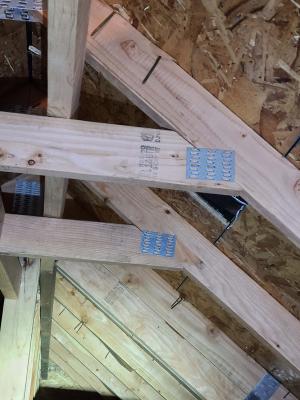 Wrong - Roof deck sheathing nails missed the trusses, potentially weakening the roof in high winds.