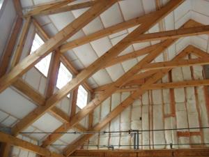 The walls and ceilings of this post-and-beam home are filled with netted blown fiberglass.