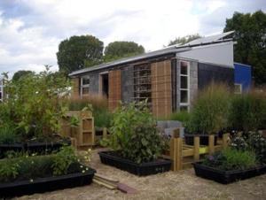The design of this home incorporates multiple methods to reduce summertime solar gains including roll-down exterior blinds, wide exterior horizontal louvers, minimized east/west-facing windows, and vegetation.