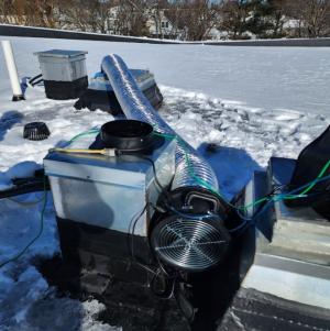 Right - Flex duct is used to connect the duct tester to the top of a duct riser where it meets the roof; connecting the duct tester to the largest part of the ductwork helps ensure uniform pressure distribution during a duct leakage test 