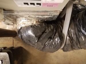Wrong - Flex duct insulation is overly compressed in 3 ways; Zip-tie fastener is over the insualtion not under the insulation at the duct boot collar, duct turning radius is too tight, and support strap is too tight.
