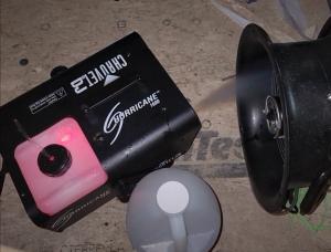 When using a theatrical fog machine to detect duct leakage, point the fog stream toward the outer edge of the test fan opening to avoid fouling the fan motor