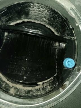 This constant airflow regulator (CAR) has been fouled by deposition of aerosolized sealant because it was not protected during duct sealing 