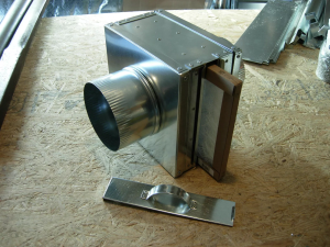 This fresh air intake filter box provides for access to a replaceable filter for air intake duct with a 6-inch collar. 