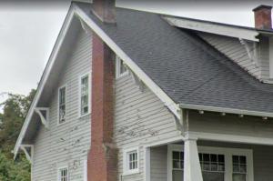 Gable end wall showing significant weathering due to exposure