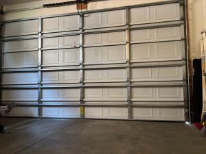 This bottom seal on this garage door looks fairly tight, except in the right corner where there is 4-inch gap.