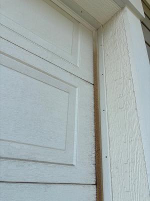 The vinyl weatherstripping along the side of this garage door has been badly weathered and needs to be replaced.