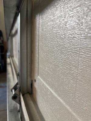 When adding insulation to a garage door, measure your door framing to determine what thickness of rigid foam the space will allow.