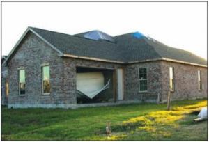Wrong – Garage door failure due to positive pressures from hurricane force winds. 