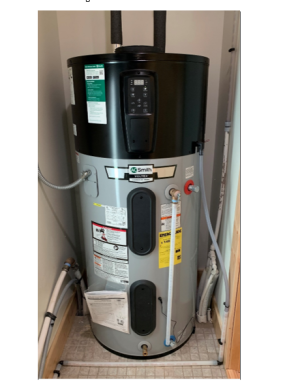 Heat pump water heater is installed in the interior closet of a multifamily dwelling unit