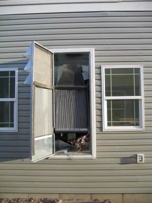 This wall-mounted evaporative cooler is easy to access for maintenance