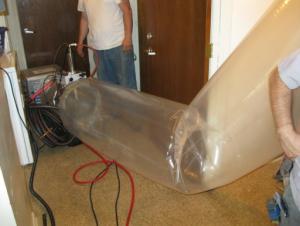 The duct sealing spray injection system application tunnel inflates as the injection system operates