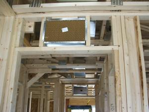 Right – Transfer grilles are installed over doorways to bedrooms in a new-construction home