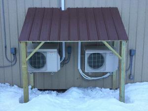 This HVAC awning is made of metal roofing that is attached directly to the lumber framing.