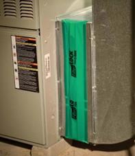 The air filter slot on this furnace is covered with a magnetic seal.