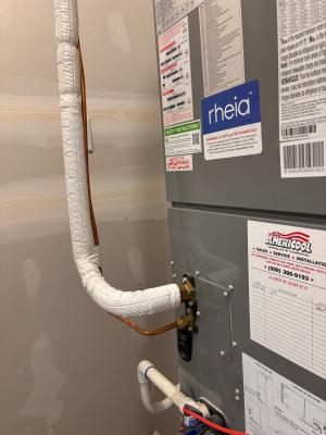 The inside refrigerant line leading from the air conditioner or heat pump to the wall should be covered with pipe insulation and a vapor barrier to reduce condensation potential and improve system efficiency.