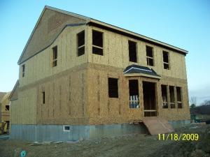 Install structural sheathing in exterior walls to resist wind pressure